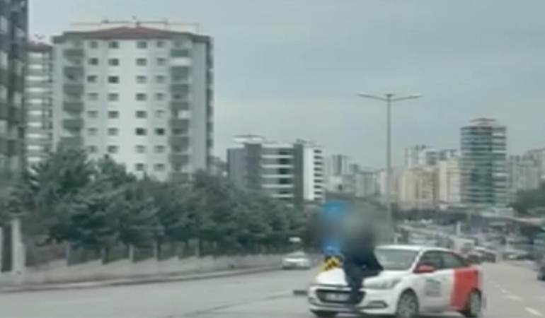 Tartışma sonrası aracın kaputunda metrelerce sürüklendi